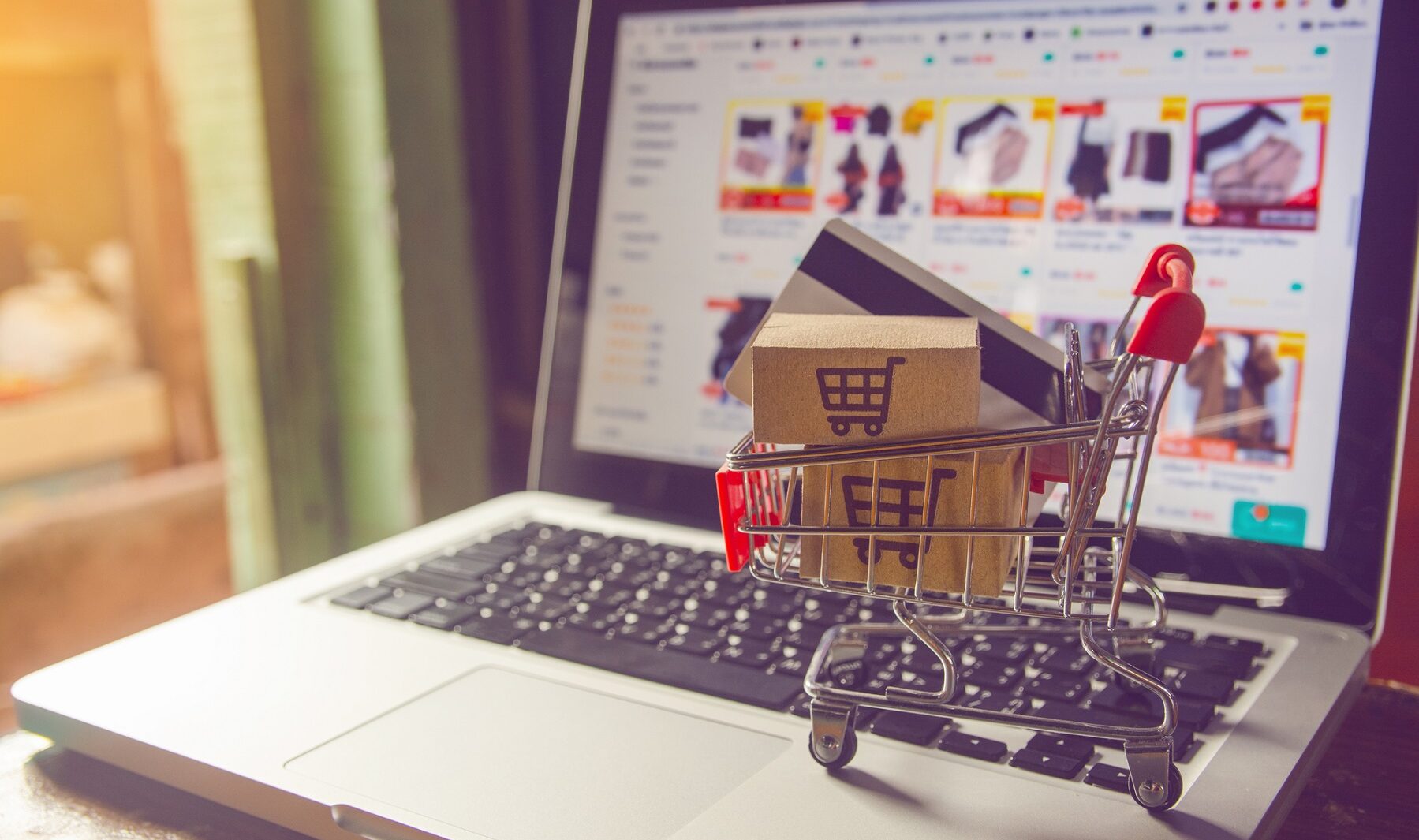 Shopping online concept - Parcel or Paper cartons with a shoppin